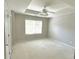 Bright, spacious bedroom with large window and door to the bathroom at 230 Valley Xing, Canton, GA 30114