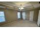 Bright, spacious bedroom with large windows and neutral walls and ceiling fan at 230 Valley Xing, Canton, GA 30114