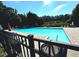 Community pool surrounded by trees and featuring a view of the sky at 230 Valley Xing, Canton, GA 30114