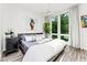 Main bedroom with a king-size bed and large windows at 462 Latta Ne St, Atlanta, GA 30308