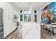 Modern kitchen with white cabinets and a large quartz waterfall island at 462 Latta Ne St, Atlanta, GA 30308