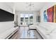 Spacious living room with a white sectional sofa and large windows at 462 Latta Ne St, Atlanta, GA 30308