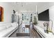 Open concept living room and kitchen with white sofas and hardwood floors at 462 Latta Ne St, Atlanta, GA 30308