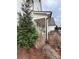 Side view of a home with landscaping and a porch at 4730 Down Setting Rd, Cumming, GA 30028