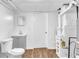 Basement bathroom with toilet, vanity, and grey cabinet at 2729 Oxford Dr, Decatur, GA 30034