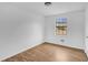 Bright bedroom with light wood laminate flooring and large window at 2729 Oxford Dr, Decatur, GA 30034