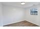 Simple bedroom with light wood laminate flooring and large window at 2729 Oxford Dr, Decatur, GA 30034