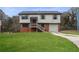 Two-story house with brick and siding, a grassy yard, and a driveway at 2729 Oxford Dr, Decatur, GA 30034