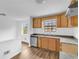 Modern kitchen boasts wood cabinets, granite countertops, and updated flooring at 2729 Oxford Dr, Decatur, GA 30034