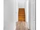 Clean stairwell with light wood laminate flooring and white walls at 2729 Oxford Dr, Decatur, GA 30034