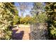 Ornate black gate opens to a brick patio and lush garden at 2933 Andrews Nw Dr, Atlanta, GA 30305