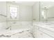 Bathroom with marble bathtub and vanity at 2933 Andrews Nw Dr, Atlanta, GA 30305