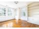 Bedroom with hardwood floors and built-in bookshelves at 2933 Andrews Nw Dr, Atlanta, GA 30305