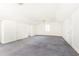 Spacious bonus room with grey carpet and ample natural light at 2933 Andrews Nw Dr, Atlanta, GA 30305