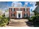 Brick Georgian home with a symmetrical facade, grand entryway, and mature landscaping at 2933 Andrews Nw Dr, Atlanta, GA 30305