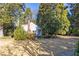 White guest house with a chimney and surrounded by trees at 2933 Andrews Nw Dr, Atlanta, GA 30305