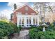 Brick house with sunroom and landscaped grounds at 2933 Andrews Nw Dr, Atlanta, GA 30305