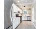 Renovated kitchen features white cabinets, stainless steel appliances, and granite countertops at 2933 Andrews Nw Dr, Atlanta, GA 30305