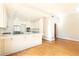 Bright kitchen boasts hardwood floors and white cabinetry at 2933 Andrews Nw Dr, Atlanta, GA 30305