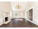 Living room with hardwood floors, fireplace, and chandelier at 2933 Andrews Nw Dr, Atlanta, GA 30305