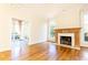 Living room with hardwood floors, fireplace and sunroom access at 2933 Andrews Nw Dr, Atlanta, GA 30305