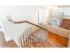 Elegant staircase featuring hardwood floors and ornate railing at 2933 Andrews Nw Dr, Atlanta, GA 30305