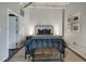 Cozy bedroom with metal bed frame and exposed brick at 878 Peachtree Ne St # 535, Atlanta, GA 30309