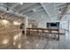 Modern common area featuring a large table with chairs, polished concrete floors, and exposed duct work at 878 Peachtree Ne St # 535, Atlanta, GA 30309