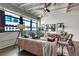 Stylish living room featuring exposed brick, large windows, and modern furnishings creating an inviting space at 878 Peachtree Ne St # 535, Atlanta, GA 30309