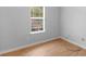 Bedroom with window and wood-look floors at 4037 Monarch Dr, Mcdonough, GA 30253