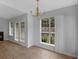 Dining area with hardwood floors, chandelier, and access to a patio at 4037 Monarch Dr, Mcdonough, GA 30253