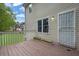 Back deck showcasing the house, lawn, and greenery at 4127 Conley Pond Ct, Decatur, GA 30034