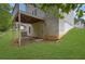 Exterior back view of a house with a deck and a spacious backyard at 4127 Conley Pond Ct, Decatur, GA 30034