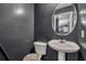 Powder bathroom with pedestal sink, tile floor, and contemporary decor at 4127 Conley Pond Ct, Decatur, GA 30034