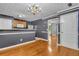 Open dining area with hardwood floors connects seamlessly to the kitchen and living room at 4127 Conley Pond Ct, Decatur, GA 30034
