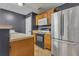Functional kitchen with stainless steel refrigerator, neutral countertops, and wood cabinets at 4127 Conley Pond Ct, Decatur, GA 30034