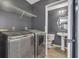 Laundry room featuring washer/dryer hookups, tile floors, and wire shelving at 4127 Conley Pond Ct, Decatur, GA 30034