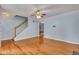 Inviting living room with hardwood floors, a staircase, and neutral wall color at 4127 Conley Pond Ct, Decatur, GA 30034