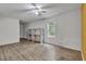Cozy living room with a ceiling fan, window, and wood-look flooring at 4127 Conley Pond Ct, Decatur, GA 30034