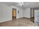 Living room featuring wood-look flooring, a ceiling fan and neutral paint at 4127 Conley Pond Ct, Decatur, GA 30034