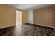 A bright living room featuring a brick wall and wood-look flooring at 4127 Conley Pond Ct, Decatur, GA 30034