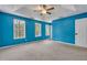 Spacious main bedroom with plush carpet and natural light at 4127 Conley Pond Ct, Decatur, GA 30034