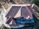 Top-down view of a home showcasing its roofline and landscaping at 1411 River Station Dr, Lawrenceville, GA 30045