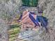 Aerial view of house showcasing roof and backyard at 1411 River Station Dr, Lawrenceville, GA 30045