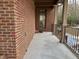 Covered back porch with brick exterior wall at 1411 River Station Dr, Lawrenceville, GA 30045