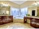 Bathroom with corner soaking tub and double vanities at 1411 River Station Dr, Lawrenceville, GA 30045