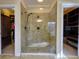 Walk-in shower with glass enclosure and built-in shelves at 1411 River Station Dr, Lawrenceville, GA 30045