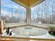 Corner jacuzzi tub with wooded views at 1411 River Station Dr, Lawrenceville, GA 30045