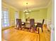 Bright dining room with hardwood floors, a large table, and six chairs at 1411 River Station Dr, Lawrenceville, GA 30045