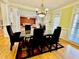 Spacious dining room with a marble table and view into the living room at 1411 River Station Dr, Lawrenceville, GA 30045